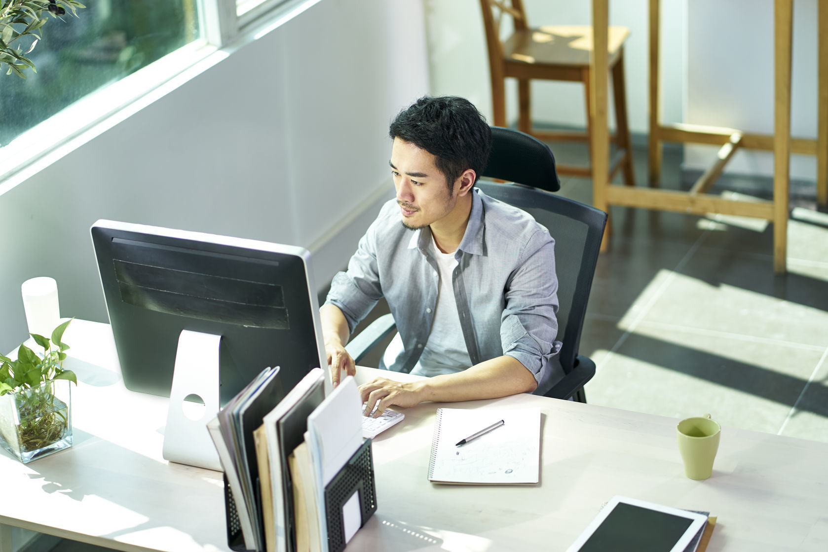 young asian businessman working in office